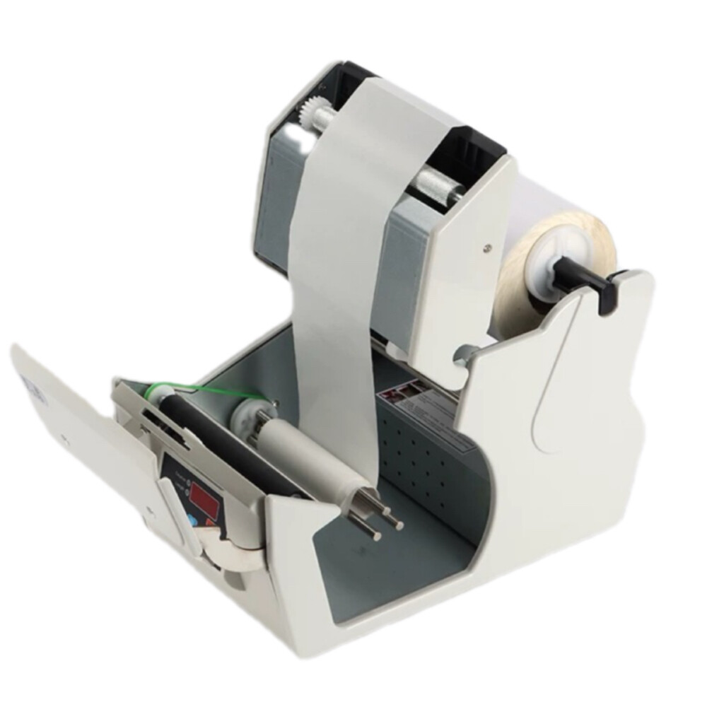 Automatic label dispenser, model X 100, length 11.00 inch, width 5.35 inch, height 6.85 inch, label width from 0.20 inch to 3.94 inch